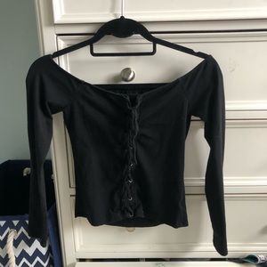 Black off the shoulder shirt. Sort of cropped.